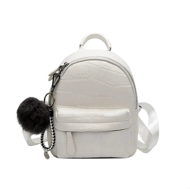 Mandotos chic mini leather backpack with adjustable straps and silver hardware, stylish and compact for everyday use.