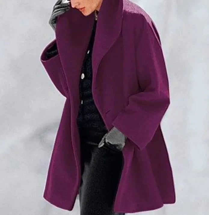 Mandotos oversized cardigan with multi-shade color blocks, featuring a relaxed fit and cozy knit fabric.