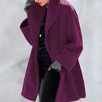 Mandotos oversized cardigan in multiple shades with a relaxed fit, featuring a cozy, stylish design and ribbed cuffs.