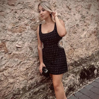 Mandotos chic off-shoulder mini dress featuring a stylish design and fitted silhouette, perfect for casual or semi-formal occasions.