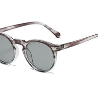 Mandotos chic round UV-block sunglasses with dark tinted lenses and thin metal frames on a white background.