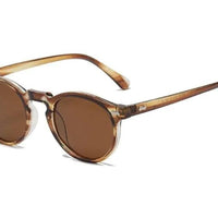 Mandotos chic round UV-block sunglasses with black frames and dark tinted lenses, stylish and protective eyewear for sunny days.