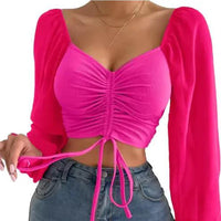 Mandotos chic V-neck crop top with balloon sleeves, featuring a stylish and trendy design perfect for casual or dressy outfits.