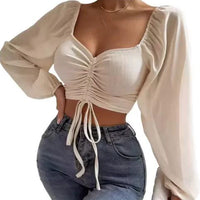 Mandotos chic V-neck balloon sleeve crop top featuring a stylish fit and trendy design, perfect for casual or chic outfits.