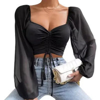 Mandotos chic V-neck balloon sleeve crop top displayed on a hanger with a solid background.