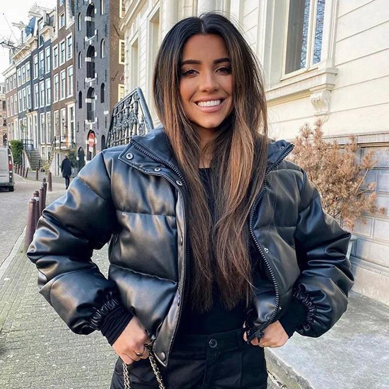 Mandotos chic winter PU leather jacket displayed on a hanger, featuring a stylish design and smooth black leather finish.