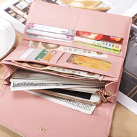 Mandotos chic women's leather clutch wallet and card holder with elegant design and compact size for daily essentials.