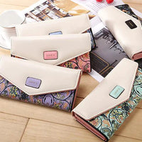 Mandotos women's leather clutch wallet and card holder, stylish compact accessory with multiple card slots and a sleek design.