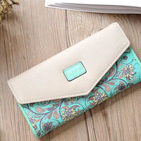 Mandotos chic women's leather clutch wallet and card holder with multiple card slots and a sleek design.