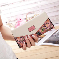 Mandotos women's leather clutch wallet and card holder with multiple card slots, black sleek design, and elegant finish.