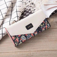 Mandotos women's leather clutch wallet with card holder, featuring a sleek design and compact size for everyday use.