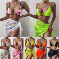 Mandotos ChicWave elegant chiffon sarong draped on a beach chair, showcasing lightweight, flowy fabric perfect for beach adventures.