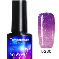Mandotos Chromatic Nail Adhesive in a clear bottle with a brush applicator for easy nail glue application.
