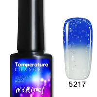 Mandotos Chromatic Nail Adhesive bottle with applicator brush, clear nail glue for strong, long-lasting manicures.