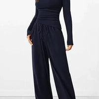 Mandotos City Comfort Asymmetrical Ensemble featuring a stylish, modern outfit with layered textures and neutral tones.
