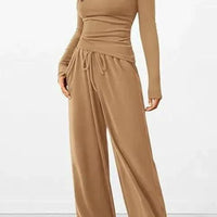 Mandotos City Comfort Asymmetrical Ensemble featuring a stylish top and matching pants in a modern, urban design.