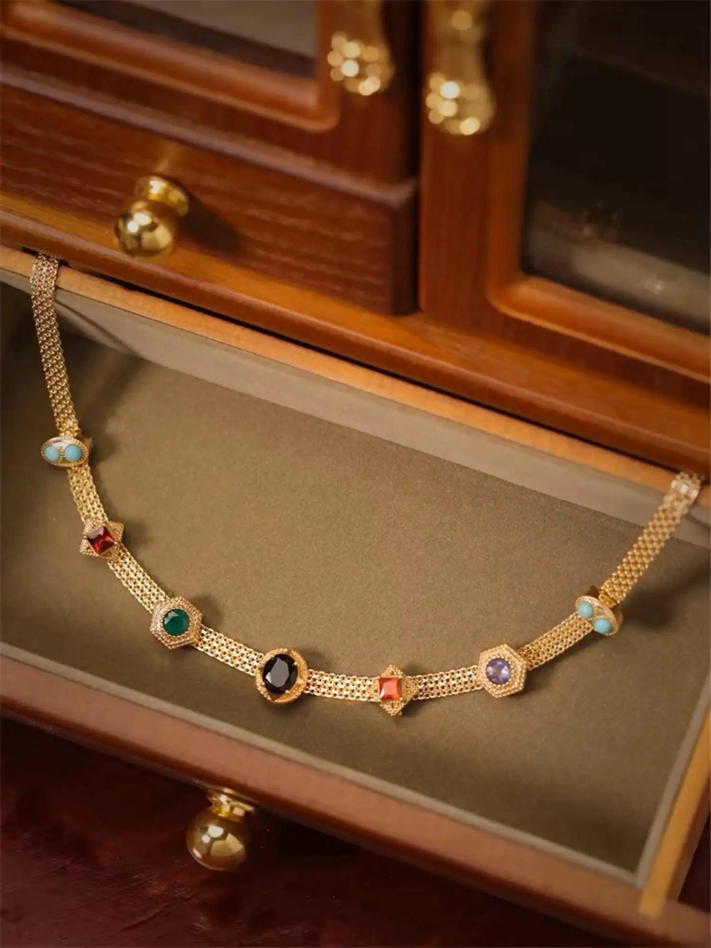 Vintage 14K gold choker necklace from MANDOTOS featuring a classic, elegant design with a polished finish.