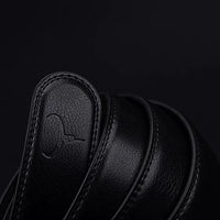 Mandotos contemporary leather belt featuring a sleek design, brown leather strap, and metal buckle for modern style and durability.