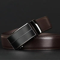 Contemporary MANDOTOS leather belt with sleek design and metal buckle, displayed on a neutral background.