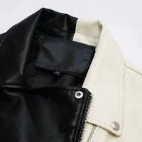 Mandotos contrast vegan leather jacket with stylish black and white color blocking, front zipper, and collar detail.