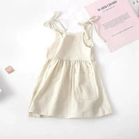 Toddler girl wearing a light blue cotton sundress with floral design from MANDOTOS, perfect for warm-weather wear.
