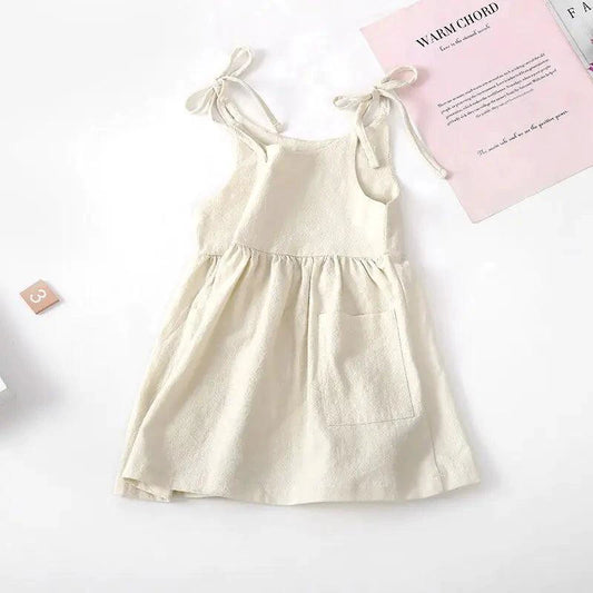 Toddler girl wearing a light blue cotton sundress with floral design from MANDOTOS, perfect for warm-weather wear.