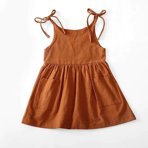 Toddler girl wearing a white cotton chic sundress by MANDOTOS, featuring a sleeveless design and floral pattern.