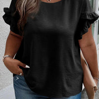 Mandotos Curvy Samantha Blouse featuring a stylish, flowy design with vibrant patterns and a comfortable fit for curvy figures.