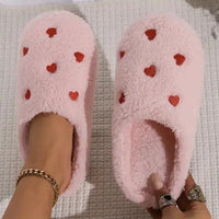 Mandotos Cushy Heart Top Fluffy Slippers with soft, plush material and heart-shaped design for cozy indoor wear.
