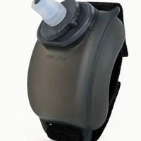Mandotos cycling wrist water bottle secured around wrist, easy to access hydration for outdoor cycling activities.