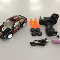 Mandotos 2.4G 4WD RC drift car toy with GTR and AE86 model, remote control, perfect for children and Christmas gifts.