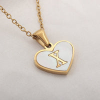 Mandotos 26-letter heart-shaped necklace with white shell accents, personalized jewelry for women, perfect for Valentine's Day.