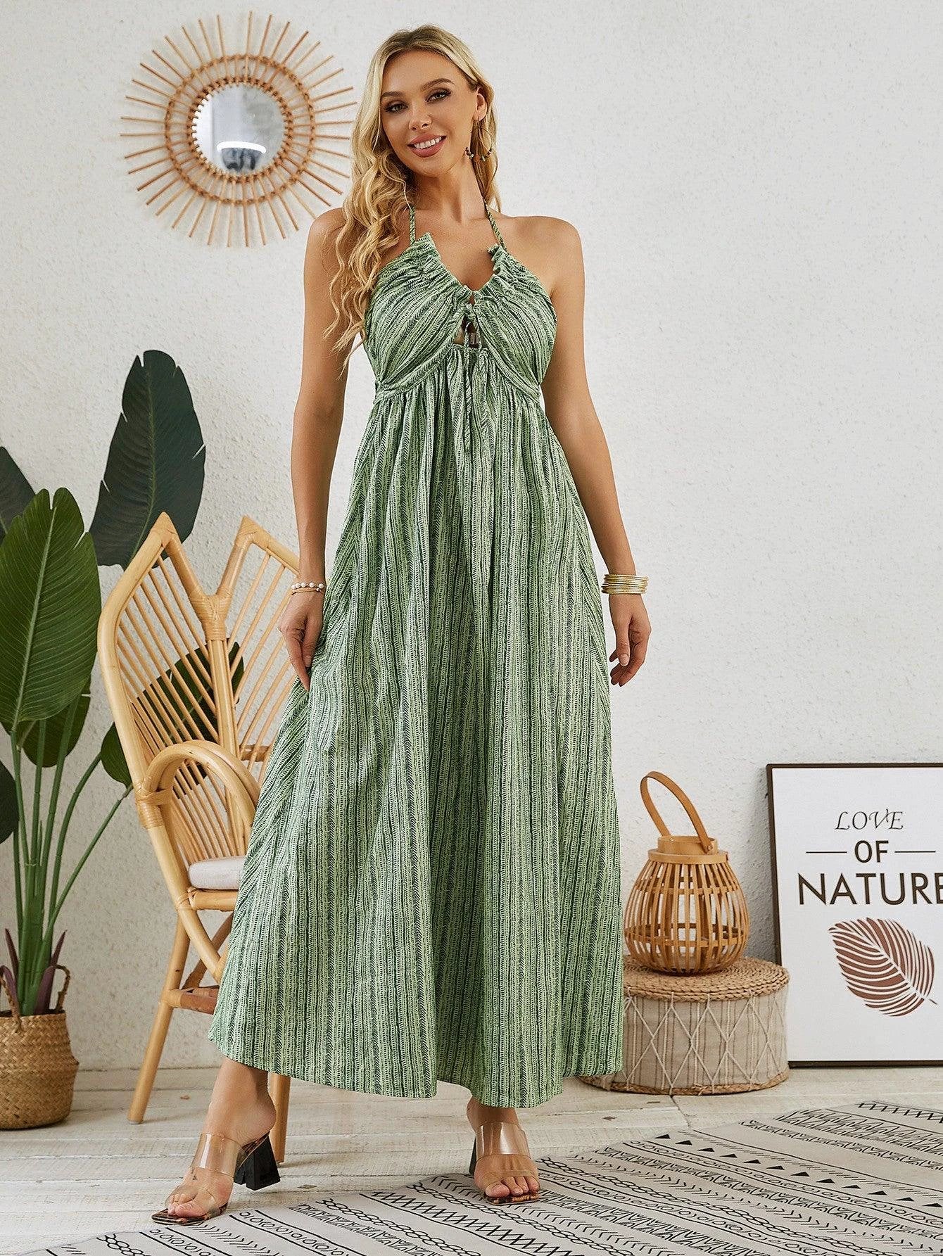 Mandotos bohemian halter maxi dress for women, sleeveless and flowy beach dress perfect for summer, with vibrant floral patterns.