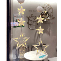 Mandotos Christmas 3-pack LED star hanging lights with suction cups, battery-powered for home decor and festive decoration.