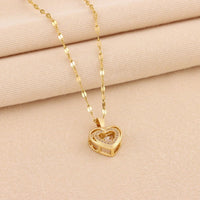 Double-layer love necklace with rhinestone accents and titanium steel pendant, by MANDOTOS, featuring elegant layered jewelry design.