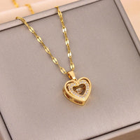 Double-layer love necklace by MANDOTOS featuring rhinestone accents and titanium steel pendant, stylish and elegant jewelry piece.