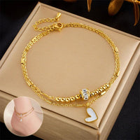 Mandotos boho love heart ankle chain with double-layer design, charm tassels, and leg chain for women’s party jewelry accessories.