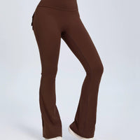 Mandotos Fierce Fit yoga pants with high waist, flared design, pockets, and scrunch butt lift for comfort and style.