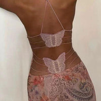 Mandotos floral print halter dress with butterfly back and spaghetti straps, stylish and feminine for summer wear.
