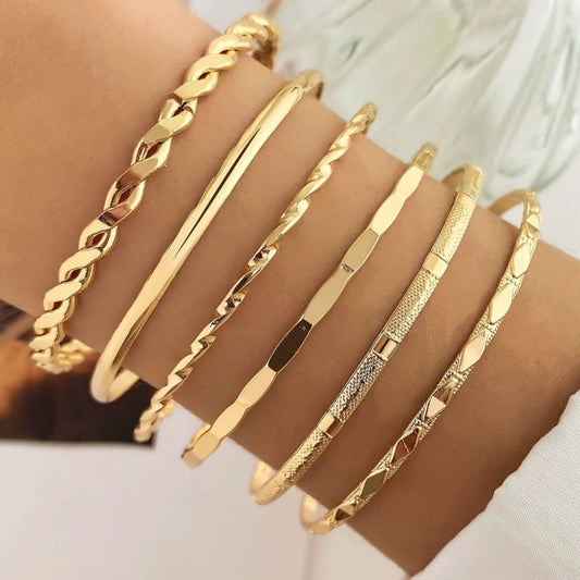 Six-piece MANDOTOS bohemian metal chain bracelet set for women featuring geometric gold-tone thick link bangles.