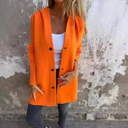 Red hooded cardigan by MANDOTOS with a loose fit and single-breasted design, shown on a hanger.