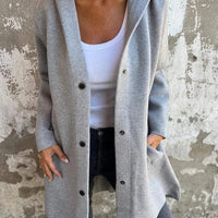 Red hooded cardigan by MANDOTOS, single-breasted loose-fit jacket with front pockets and casual style.