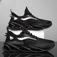 Men's black lace-up sneakers by MANDOTOS with mesh upper, hollow sole, and low-top design, suitable for running and sports activities.