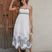 Women's cotton embroidered midi dress by MANDOTOS featuring black and white A-line design with contrast trim, ideal for vacation wear.