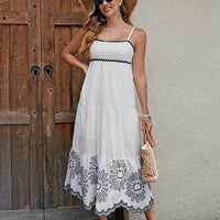 Women's cotton embroidered midi dress by MANDOTOS featuring black and white A-line design with contrast trim, ideal for vacation wear.