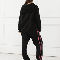 Women's long-sleeved hoodie set by MANDOTOS, featuring a comfortable, casual fit with a hood and matching pants.