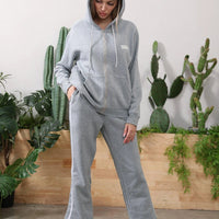 Women's long-sleeved hoodie set by MANDOTOS, featuring a comfortable top and matching pants in soft fabric.