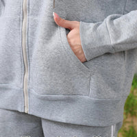 Women's long-sleeved hoodie set by MANDOTOS, featuring a casual fit and comfortable fabric, displayed on a model.