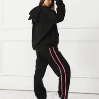 Women's long-sleeved hoodie set by MANDOTOS, featuring a comfortable, casual fit with a hood and matching pants.