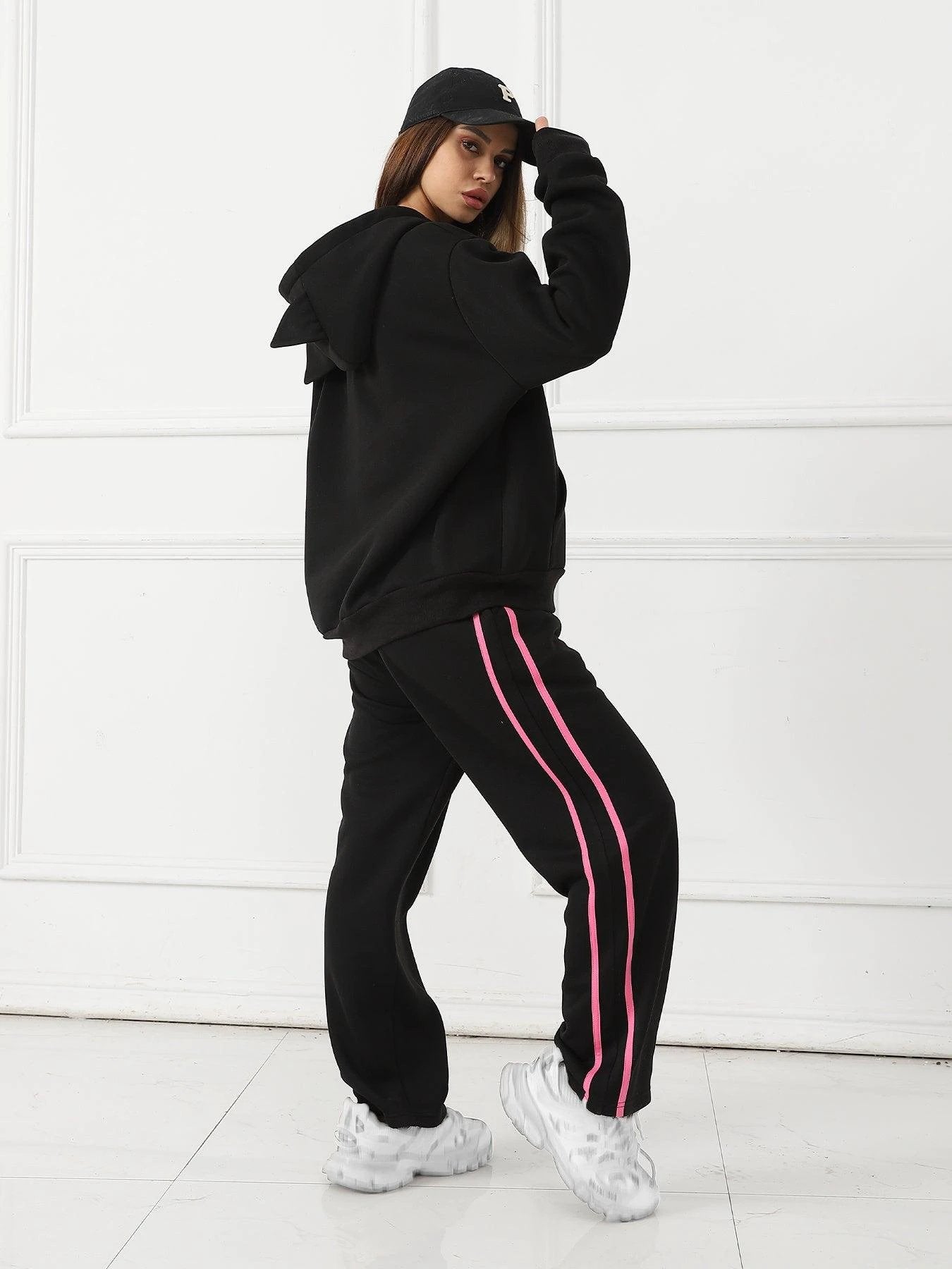 Women's long-sleeved hoodie set by MANDOTOS, featuring a comfortable, casual fit with a hood and matching pants.